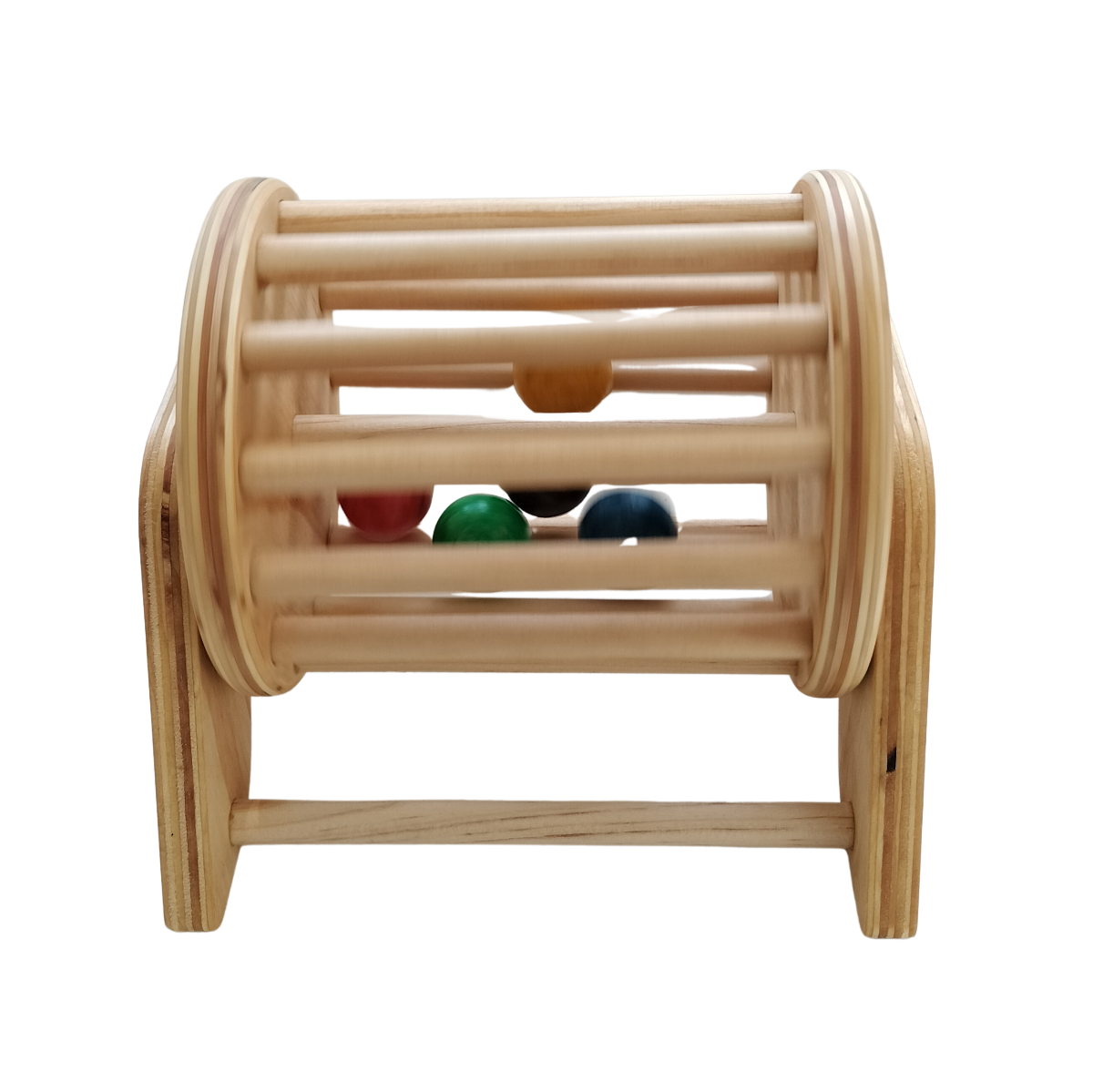 Front view of NZ handcrafted wooden ball tumbler with five coloured balls inside the dowel drum