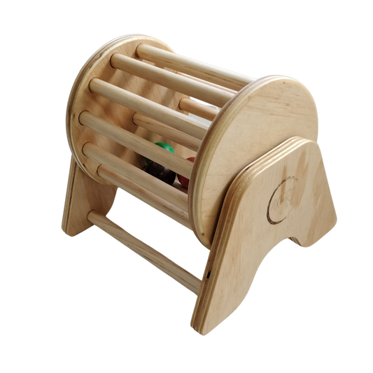 Axe & Co wooden Montessori ball tumbler spinning drum with coloured balls on an A-frame stand, angled view
