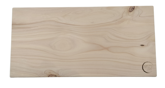 Rectangular wooden cutting board with a natural finish on a white background